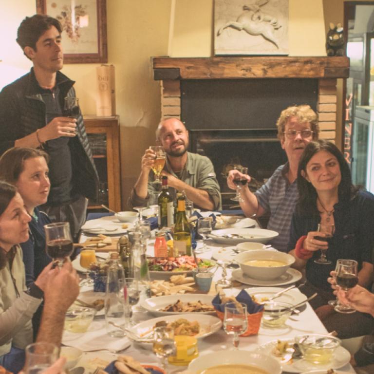 people celebrating and dining together at the table