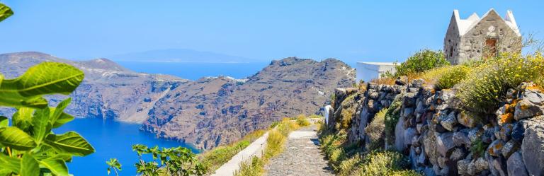walking path with a sheer cliffside view over the sea