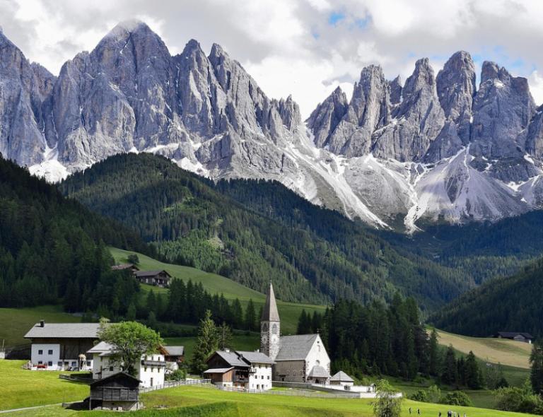 village in the dolomites in italy with mountain landscape