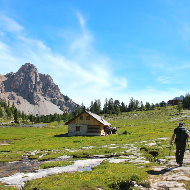 dolomites scene in Italy with two people walking