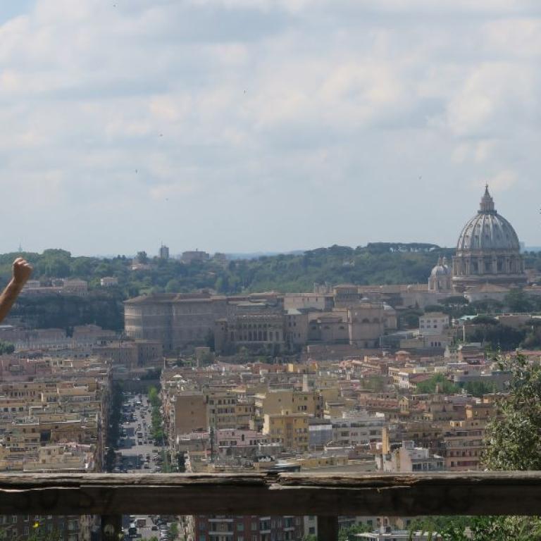 hiker celebrating arrival in Rome