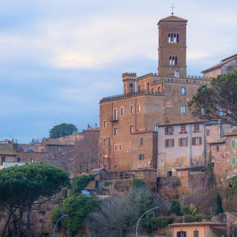 Historic village along the Via Francigena Viterbo to Rome with stone buildings and a scenic hilltop view