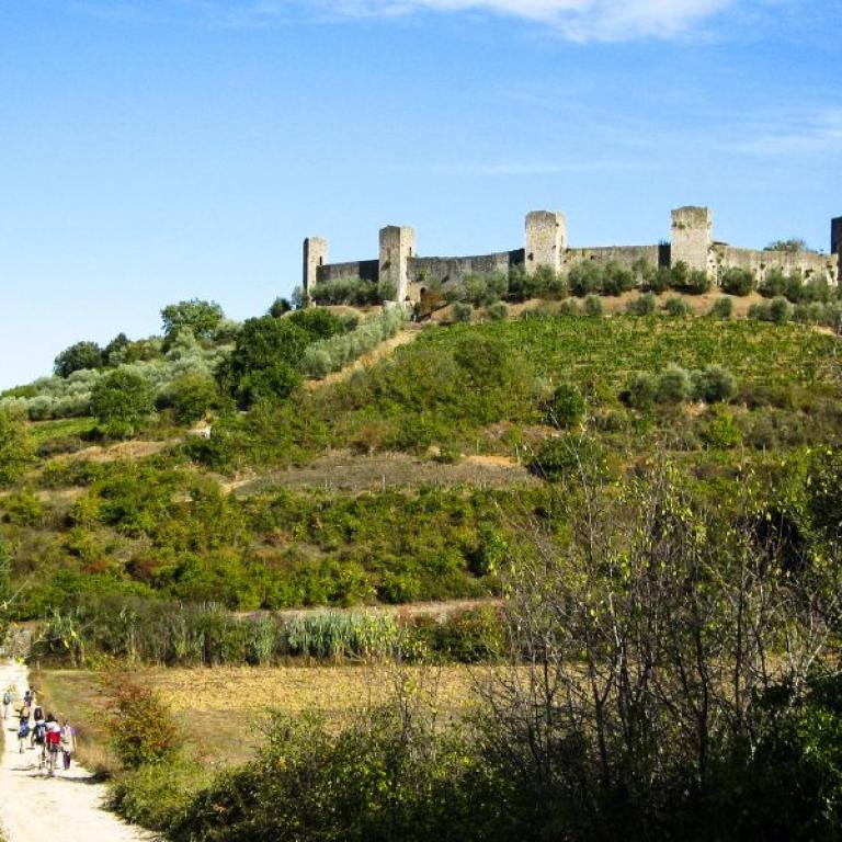 walkers on country path near Monteriggioni