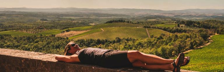 woman relaxing after walking the via francigena in tuscany