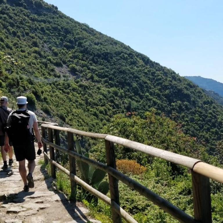 hikers walking on vernazza seaside path