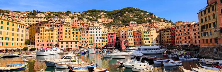 hikers relaxing at Cinque Terre with view of Punta Mesco