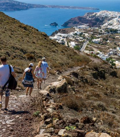 hikers descending on sea path Cyclades