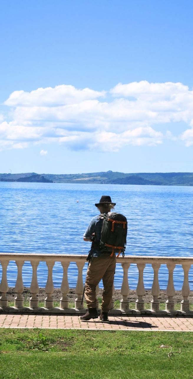 man admiring the bolsena lake during via francigena