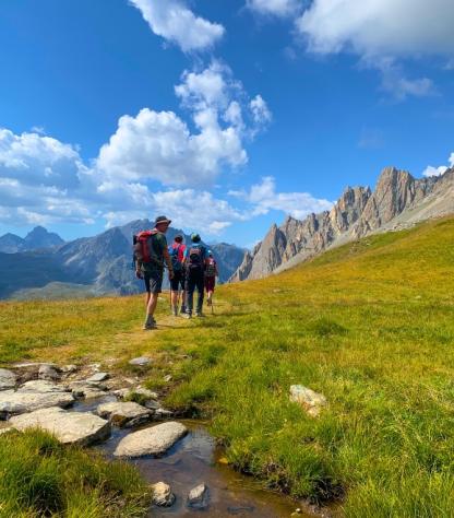 hikers walking in val maira
