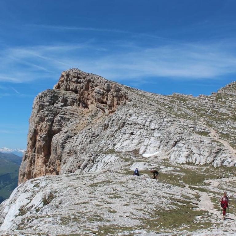 people walking the alta via in the dolomites