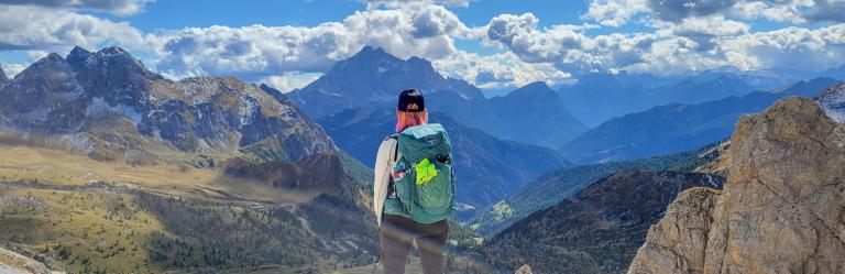 woman admiring the view after hiking the alta via