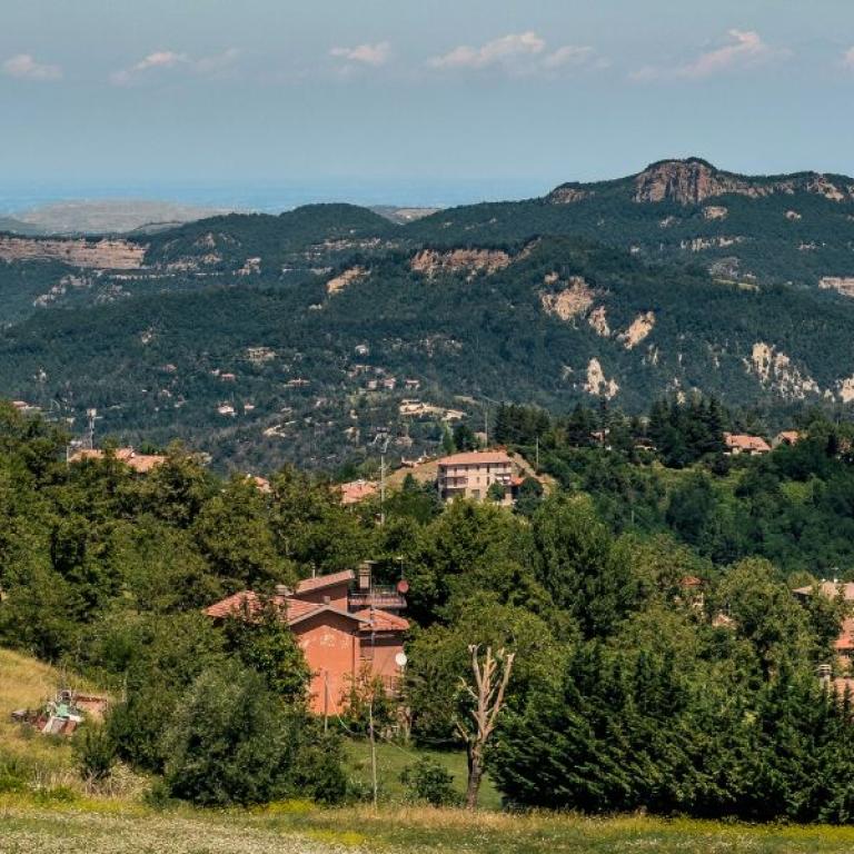 forest with houses landscape on Via degli Dei short