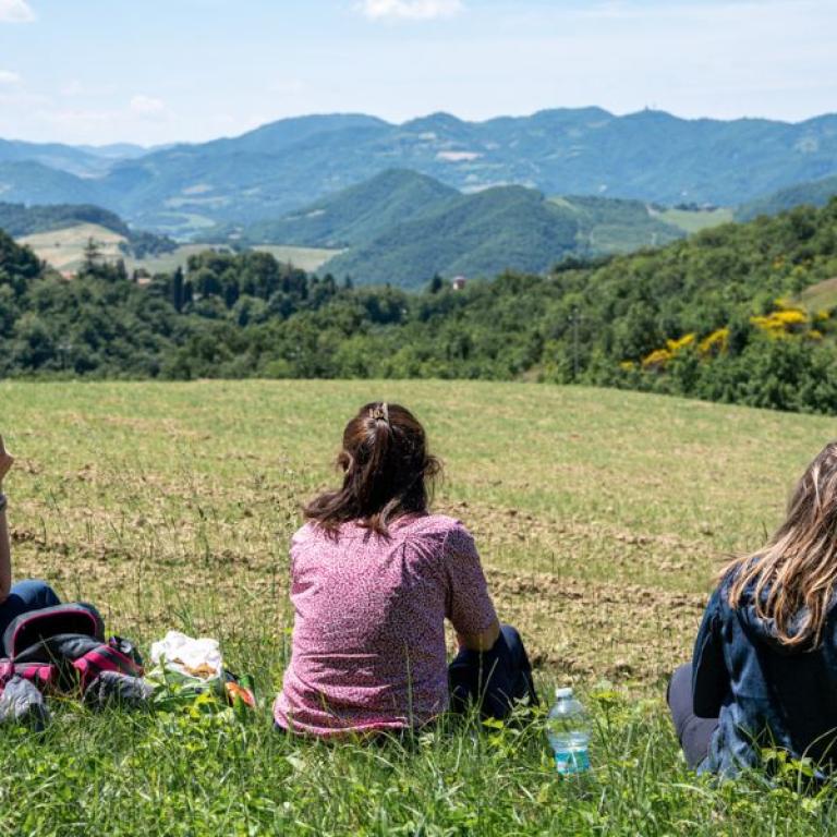 Hikers enjoying the short Via degli Dei route through the woods