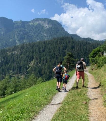 family hiking on Via Spluga mountains