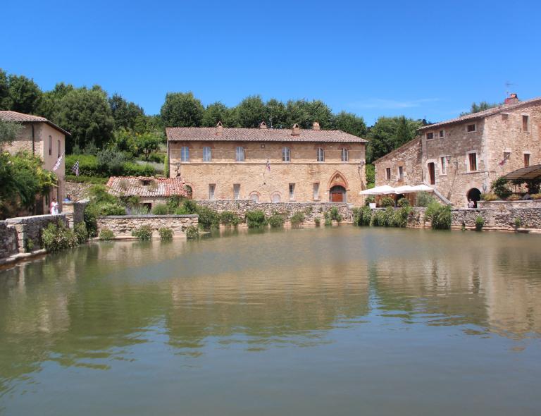 the pools of bagno vignoni in summer during a tuscany walking holiday