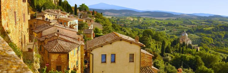 landscape of Tuscany with vineyards and walking trail during tuscany walking holidays