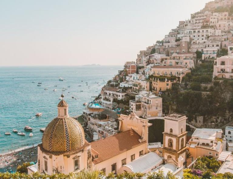 Positano’s pastel houses cascading to the sea, captured from a panoramic path on Amalfi Coast hiking tours.