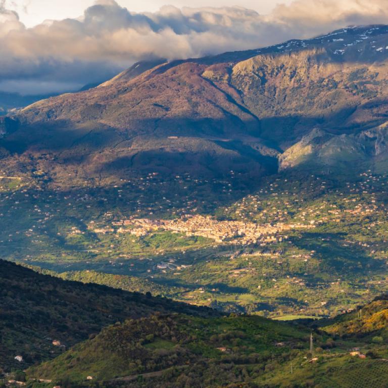 Mountain village nestled in the Madonie range at sunset, a peaceful stop along the best Sicily hiking routes