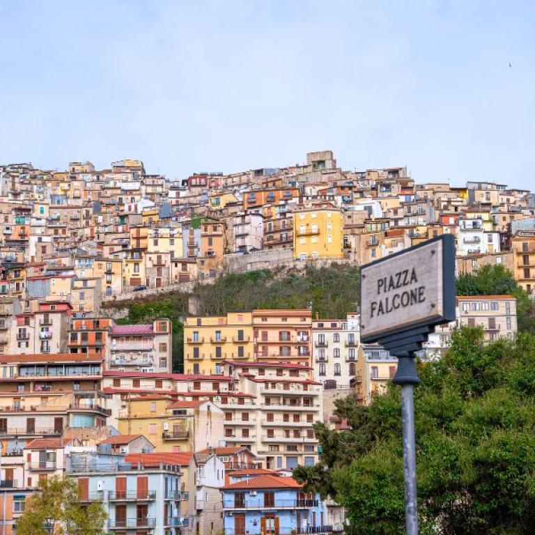 Hilltop town in Sicily seen along a scenic route for hiking in Sicily