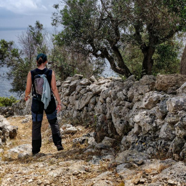 salento coast woman walking the path