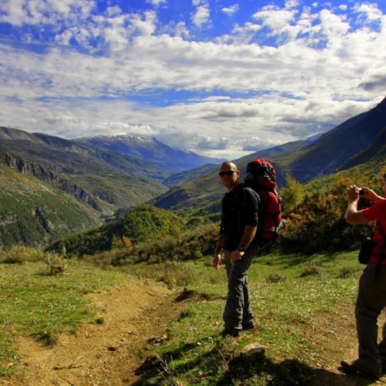 hidden valley albania hikers photographing mounts