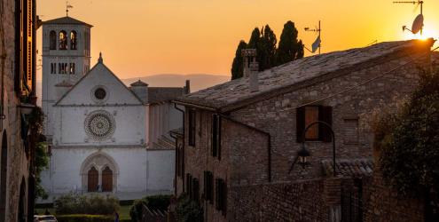 View of Assisi’s basilica at sunset from the St Francis Way