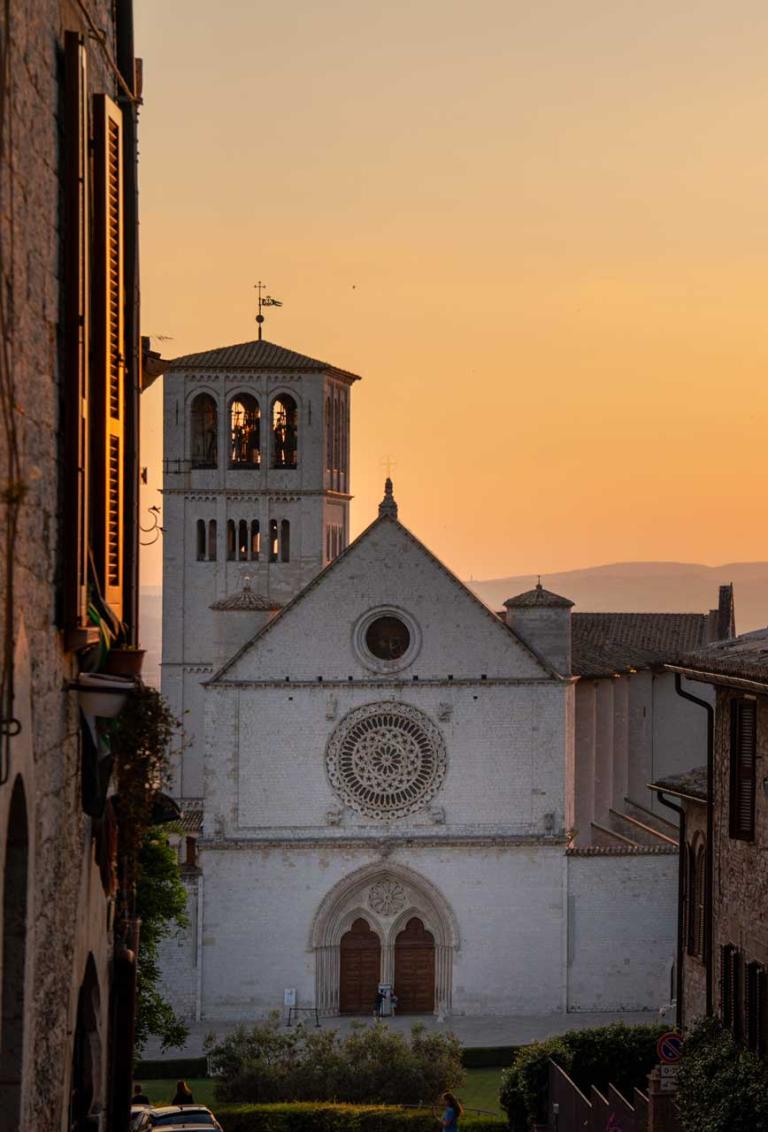 View of Assisi’s basilica at sunset from the St Francis Way