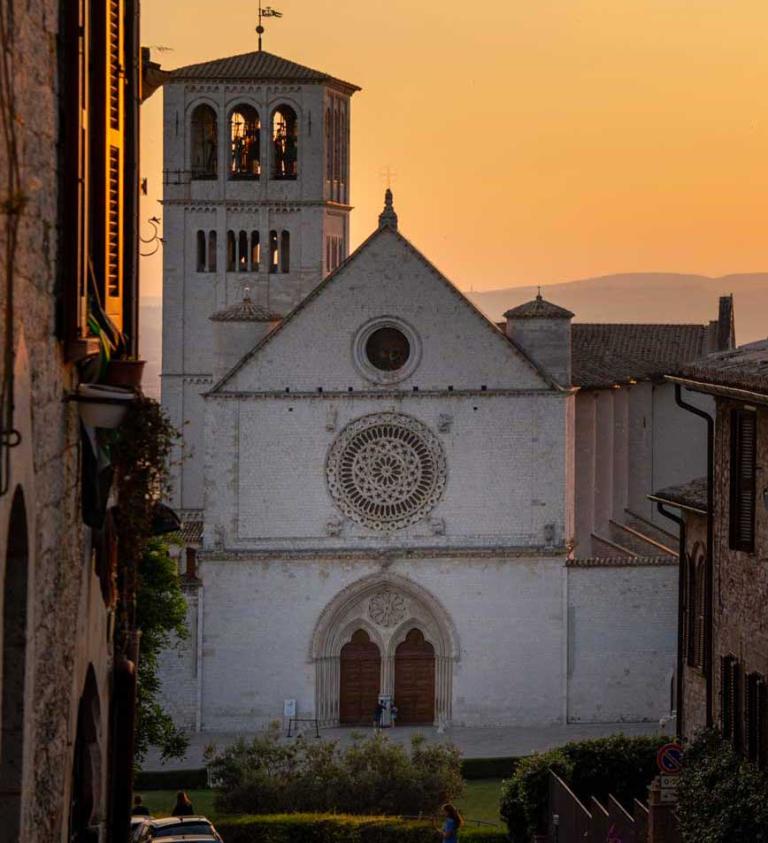 View of Assisi’s basilica at sunset from the St Francis Way