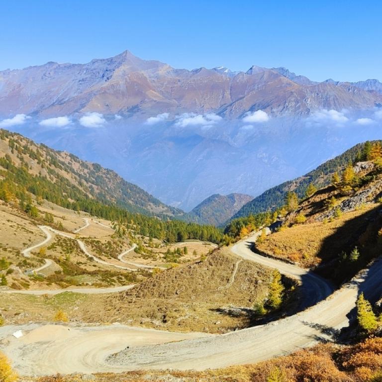 High‑altitude mountain road with sweeping valley views on the Piedmont alpine walking tour