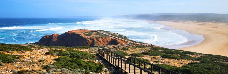 Wooden boardwalk along dramatic coastal cliffs on the Fisherman’s Trail in Portugal